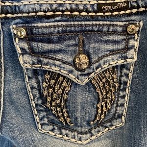 These jeans are slightly used and missing one small gem, but are in good shape!